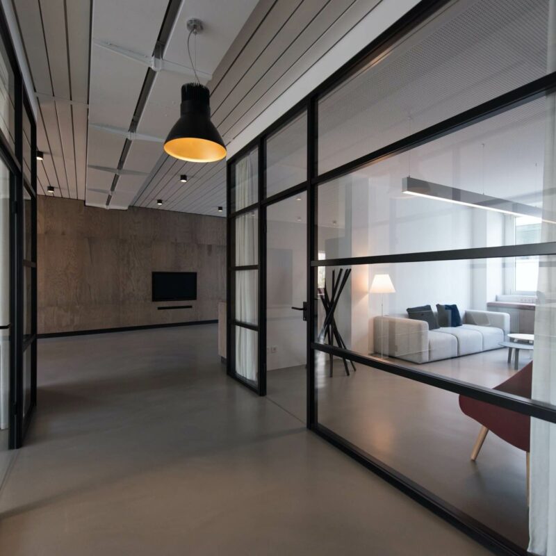 Office room with glass divider and white curtain